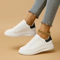 Białe skórzane buty sportowe o minimalistycznym designie dla kobiet